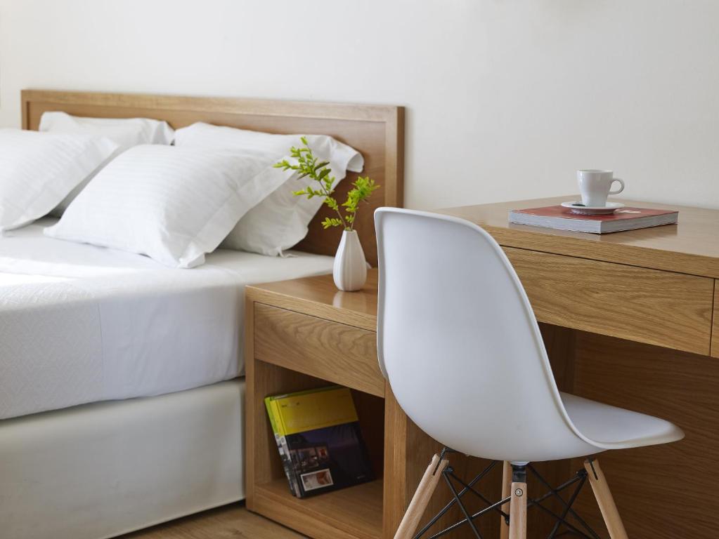 Posteľ alebo postele v izbe v ubytovaní Amarilia Hotel
