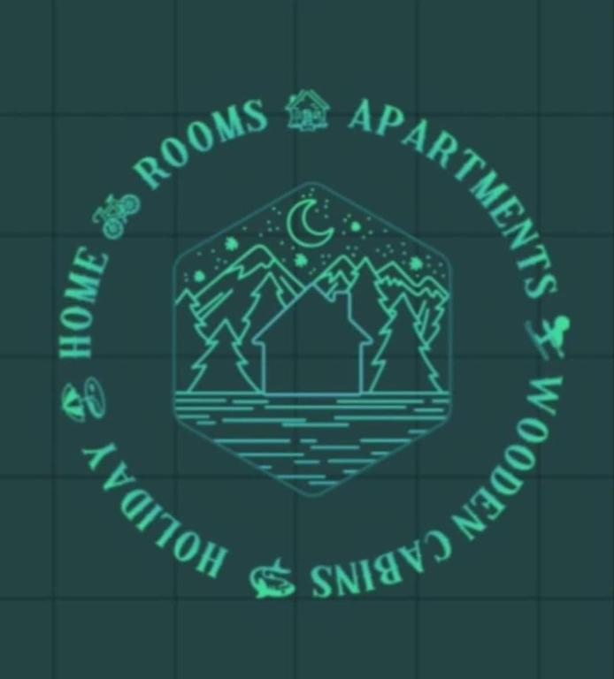 a green neon sign that says roomsaturation and avalon synergy at Holidays 4 rooms in Gol
