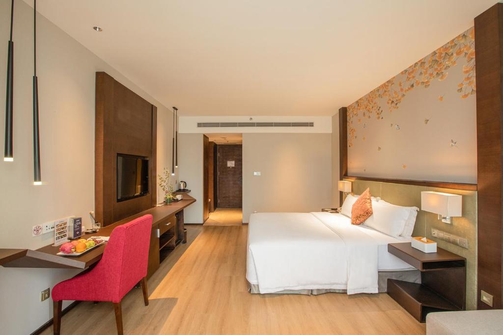 Postel nebo postele na pokoji v ubytování Lia Charlton Hotel Shenzhen