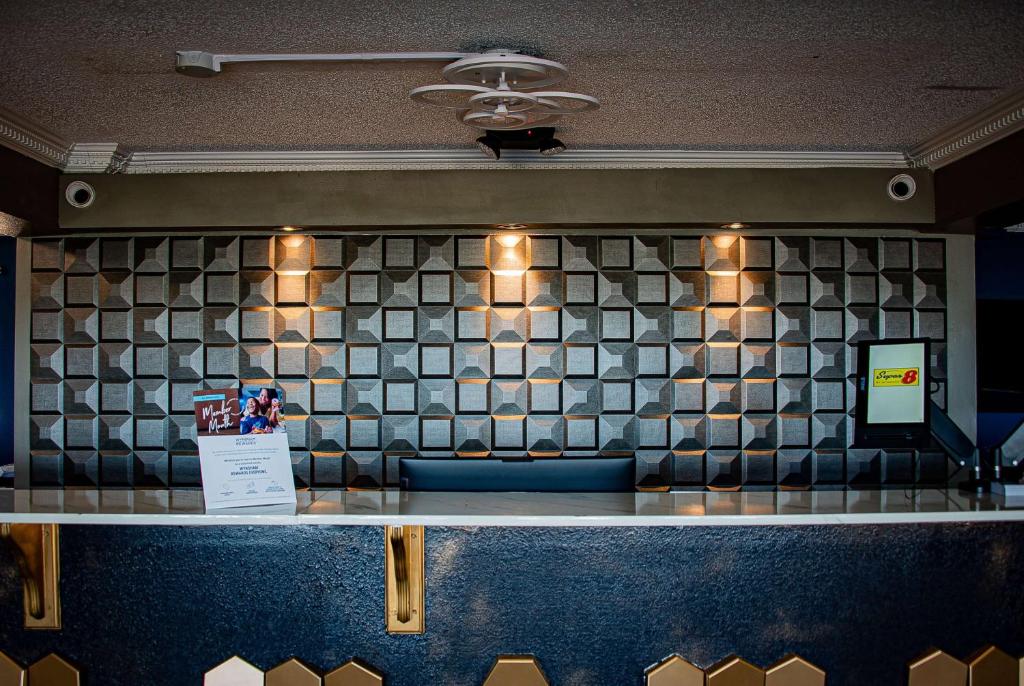 a counter in a restaurant with a tile wall at Super 8 by Wyndham Biloxi in Biloxi