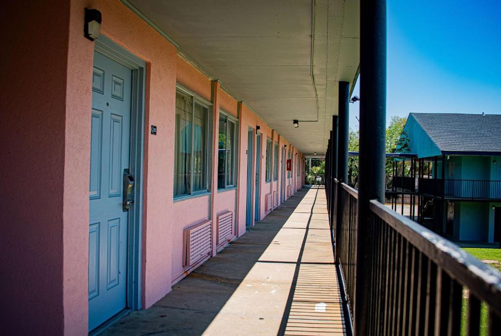 a row of colored doors on a building at Super 8 by Wyndham Biloxi in Biloxi