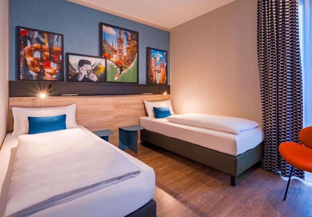 Letto o letti in una camera di Ramada Encore by Wyndham Munich Messe