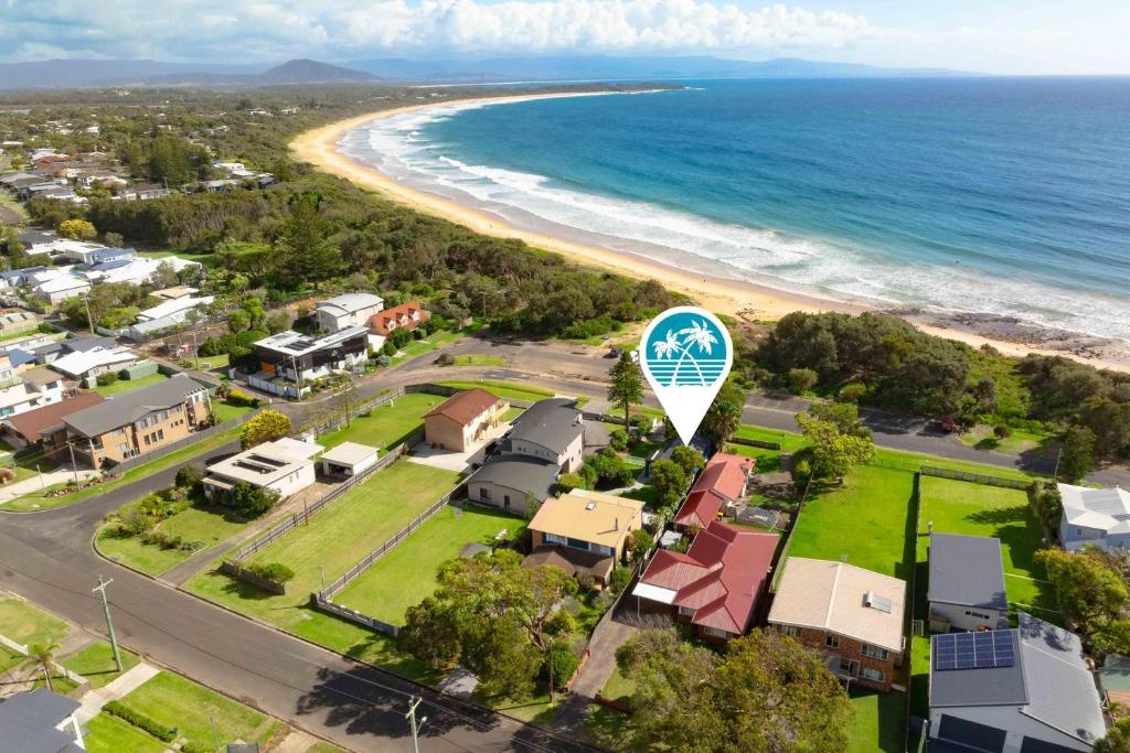 an aerial view of a suburb with a beach at Surfrider Studio - Pet Friendly - 50m to Beach! in Culburra Beach