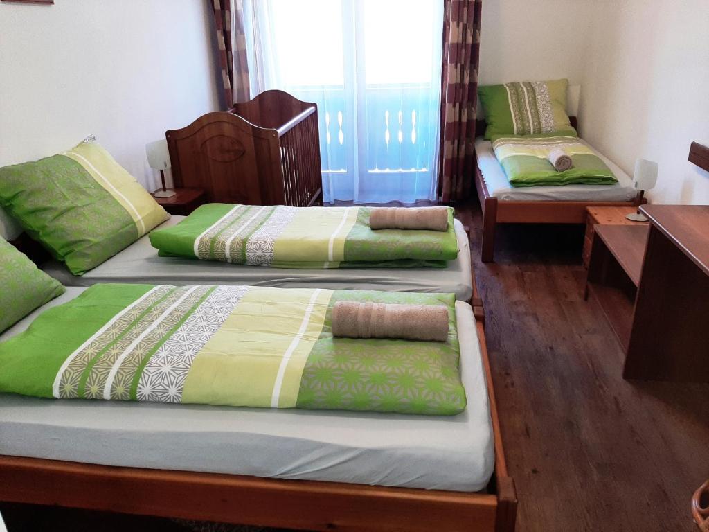 Postel nebo postele na pokoji v ubytování Szt Kristóf Bed and Breakfast