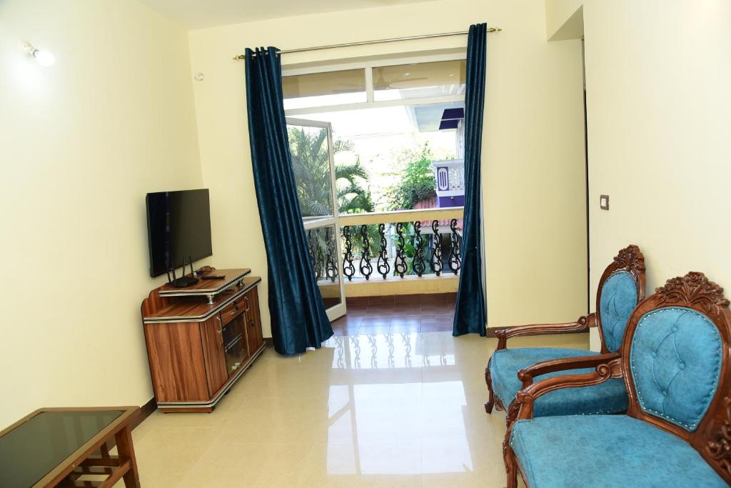 TV a/nebo společenská místnost v ubytování Dona Rosa Holiday Apartment