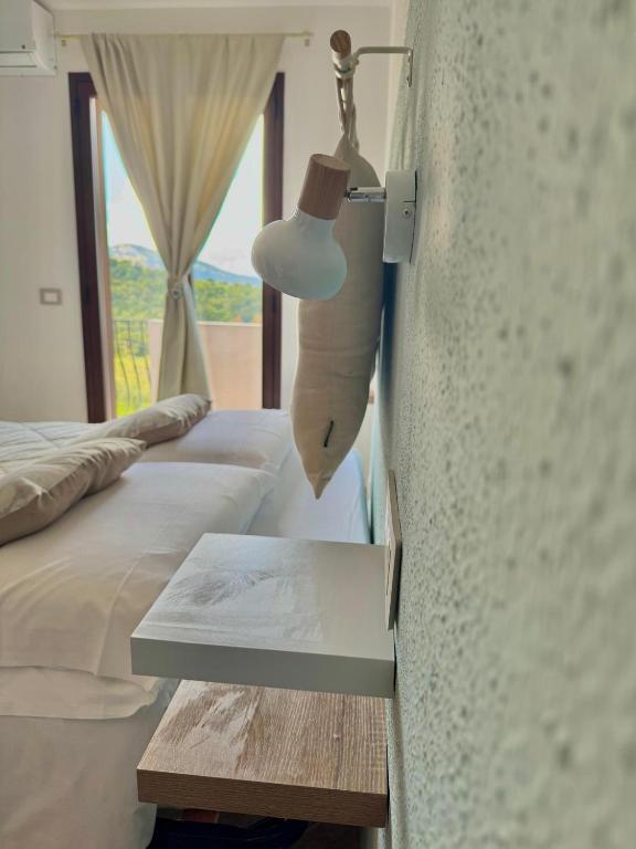 Łóżko lub łóżka w pokoju w obiekcie B&B Tiscali