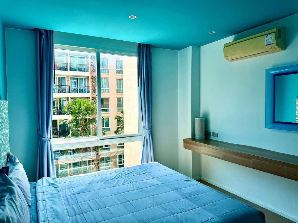 Ένα ή περισσότερα κρεβάτια σε δωμάτιο στο Atlantis Condo BB