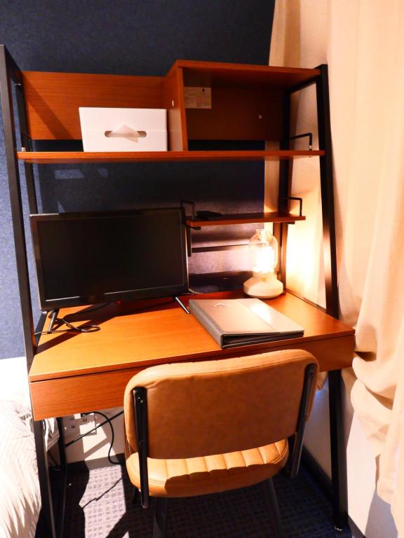 Postel nebo postele na pokoji v ubytování ForYou Honancho 方南町