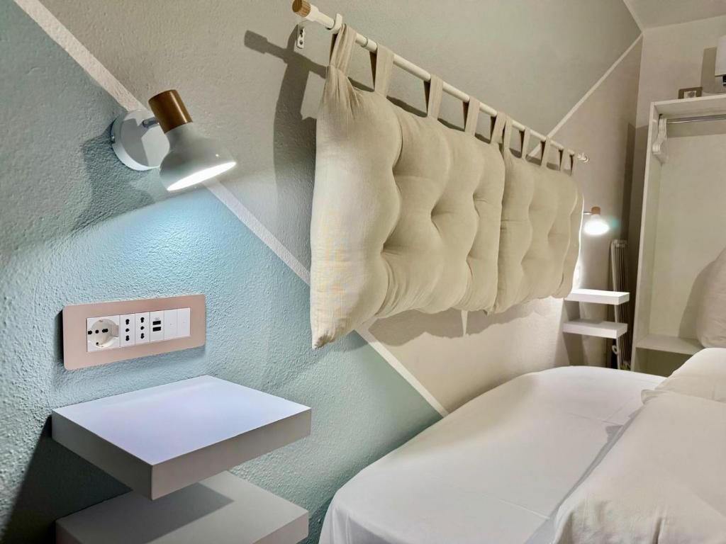 Łóżko lub łóżka w pokoju w obiekcie B&B Tiscali