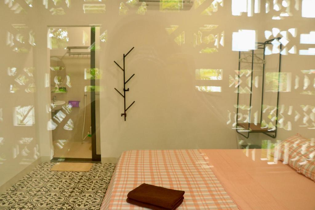 Postel nebo postele na pokoji v ubytování Sea For Rest Homestay