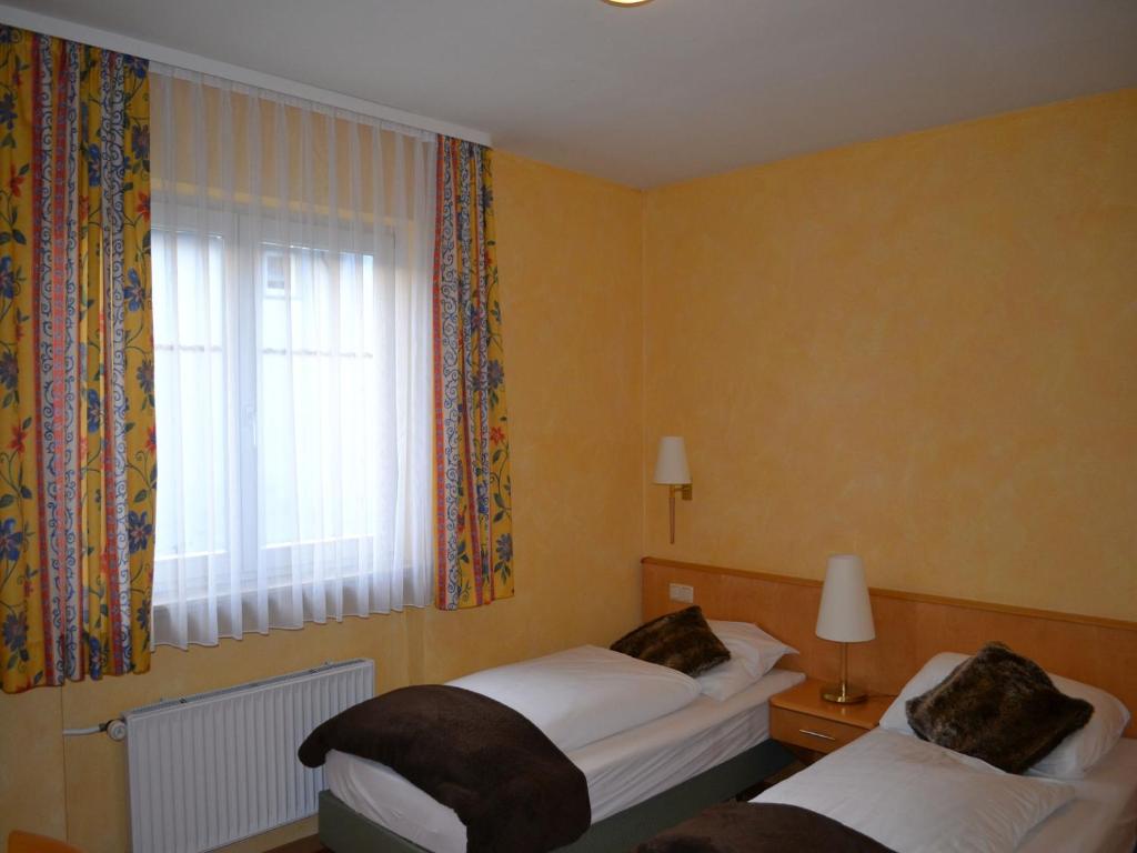 Postel nebo postele na pokoji v ubytování Hotel-Gasthof Rotes Roß