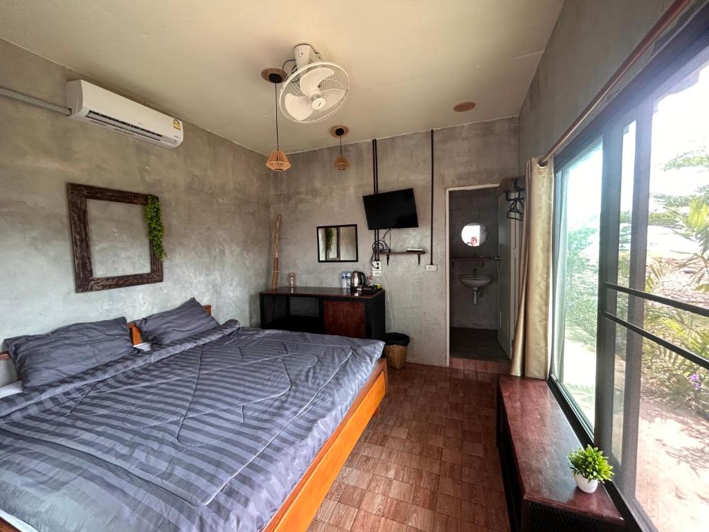 Postel nebo postele na pokoji v ubytování Tchin tchin Guesthouse