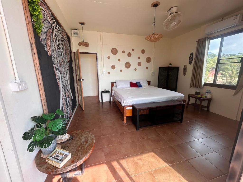 Postel nebo postele na pokoji v ubytování Tchin tchin Guesthouse