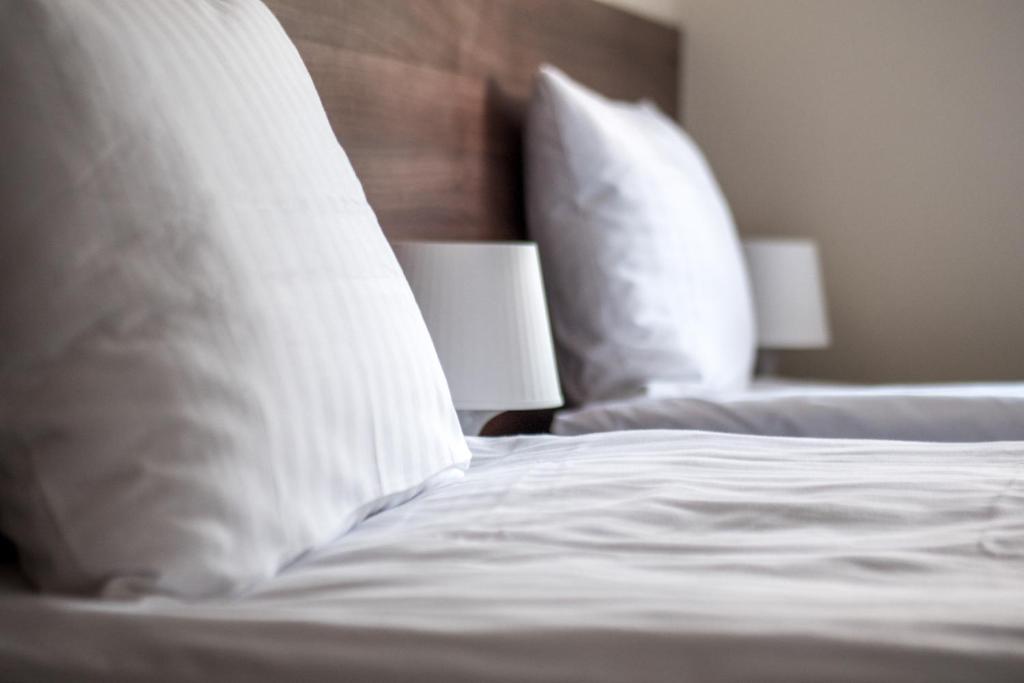 
Łóżko lub łóżka w pokoju w obiekcie Gim Apartments
