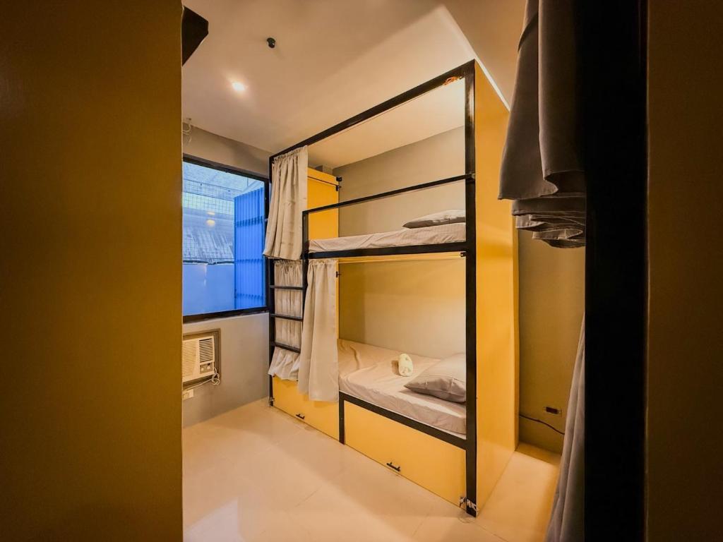Postel nebo postele na pokoji v ubytování Goofy Ants Hostel