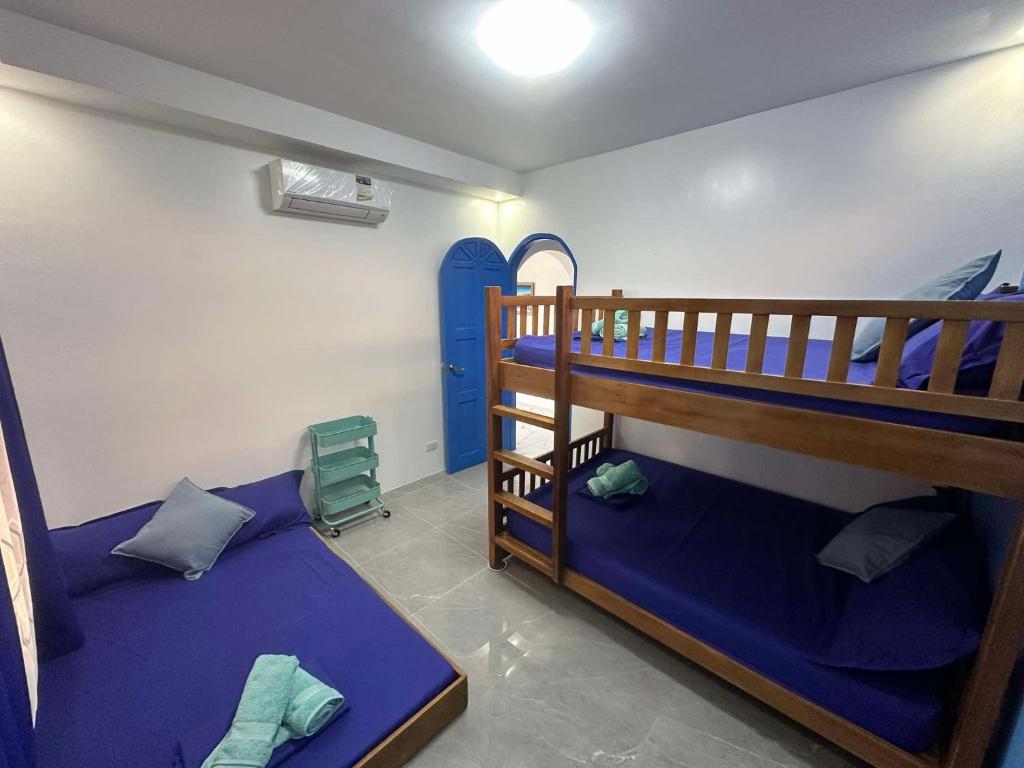 Postel nebo postele na pokoji v ubytování Aina Hannah Family Resort's Greek Unit