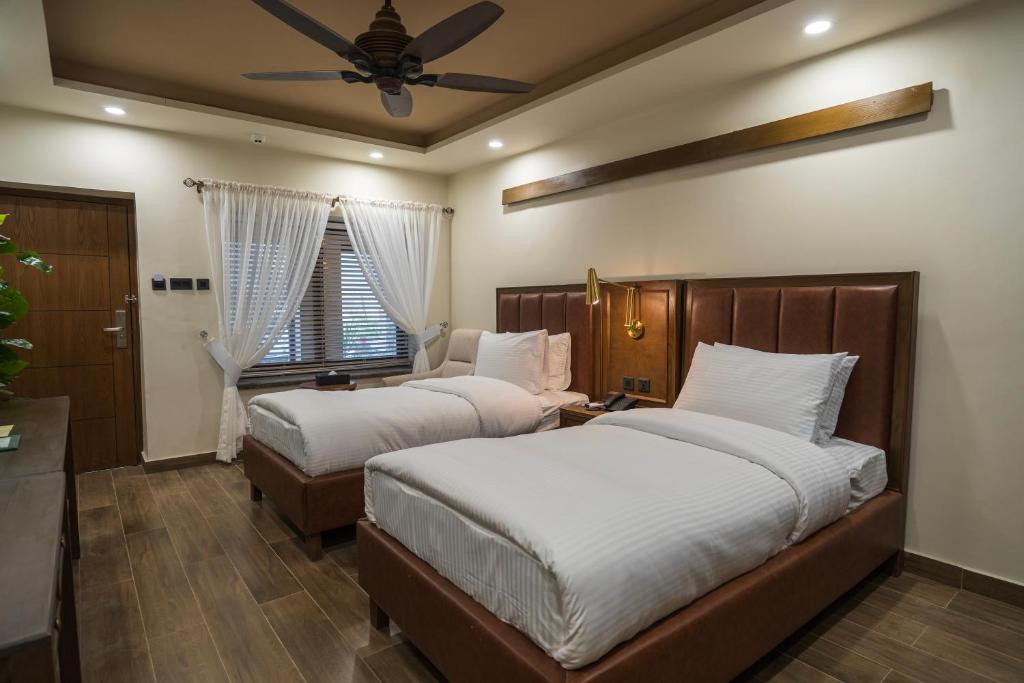 Postel nebo postele na pokoji v ubytování K2 Hotel by Green Pak Skardu