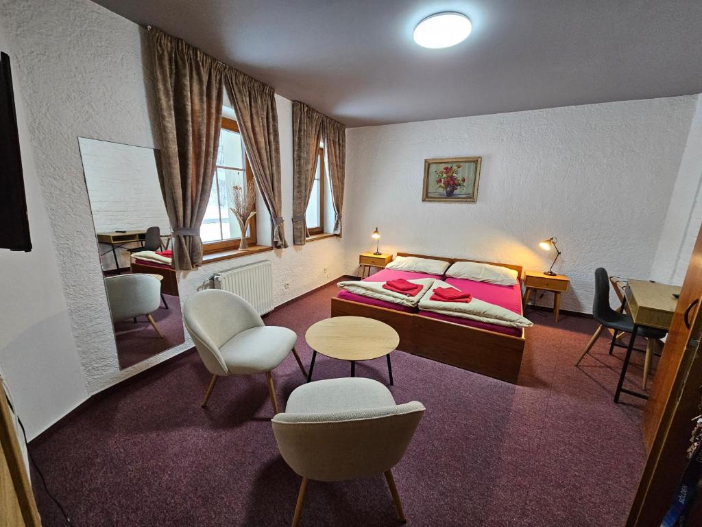Postel nebo postele na pokoji v ubytování Hotel Pivovarská bašta