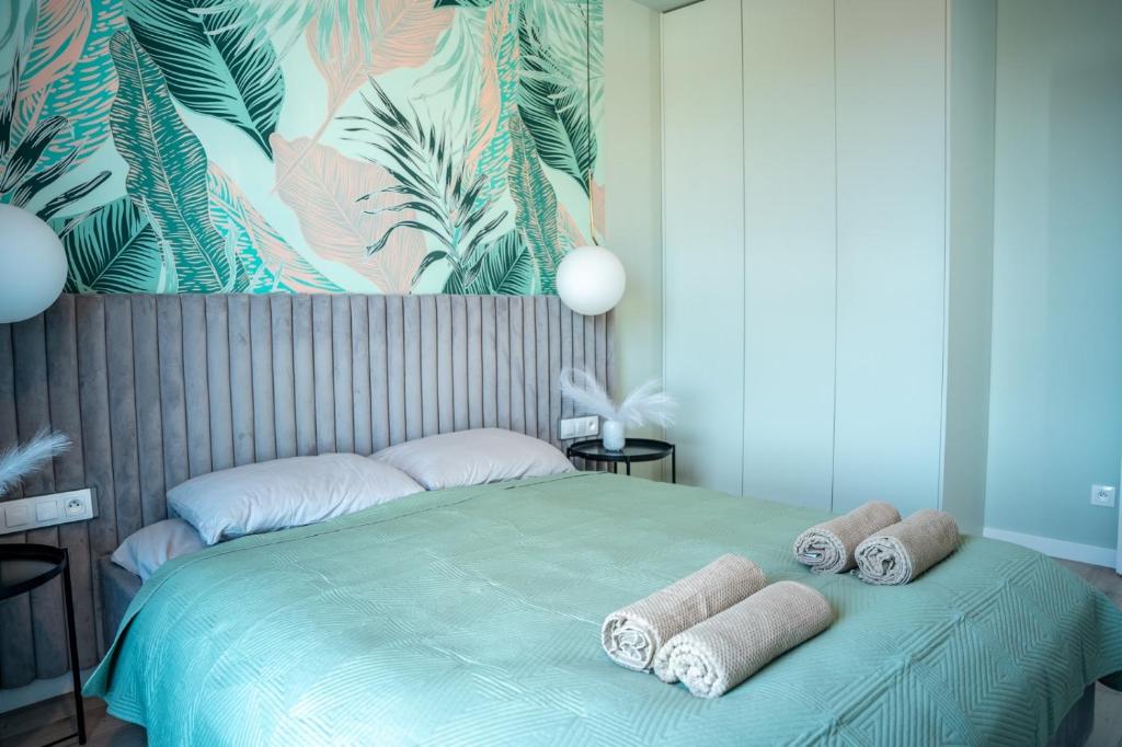 Ένα ή περισσότερα κρεβάτια σε δωμάτιο στο SEApartment z widokiem na morze