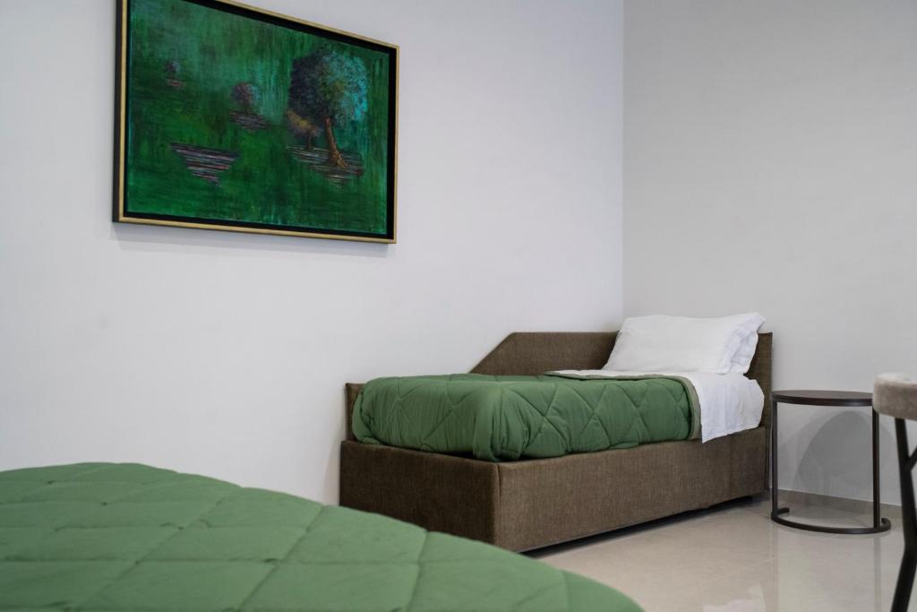 Postel nebo postele na pokoji v ubytování Pietra Viva Suite e Relax