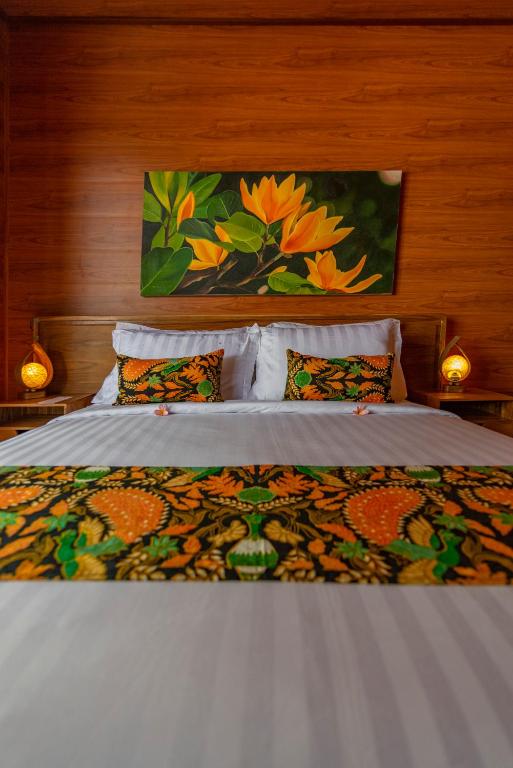 Postel nebo postele na pokoji v ubytování Uma Nandhi Villa Ubud