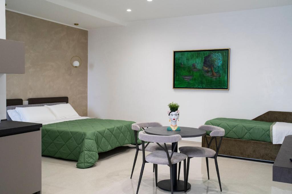 Postel nebo postele na pokoji v ubytování Pietra Viva Suite e Relax