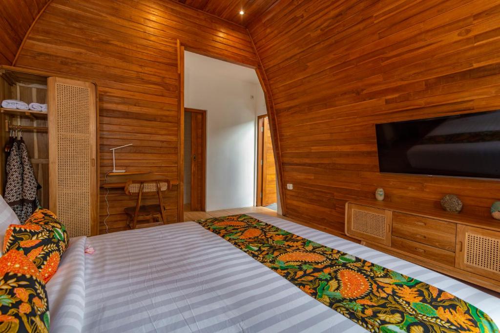 Postel nebo postele na pokoji v ubytování Uma Nandhi Villa Ubud