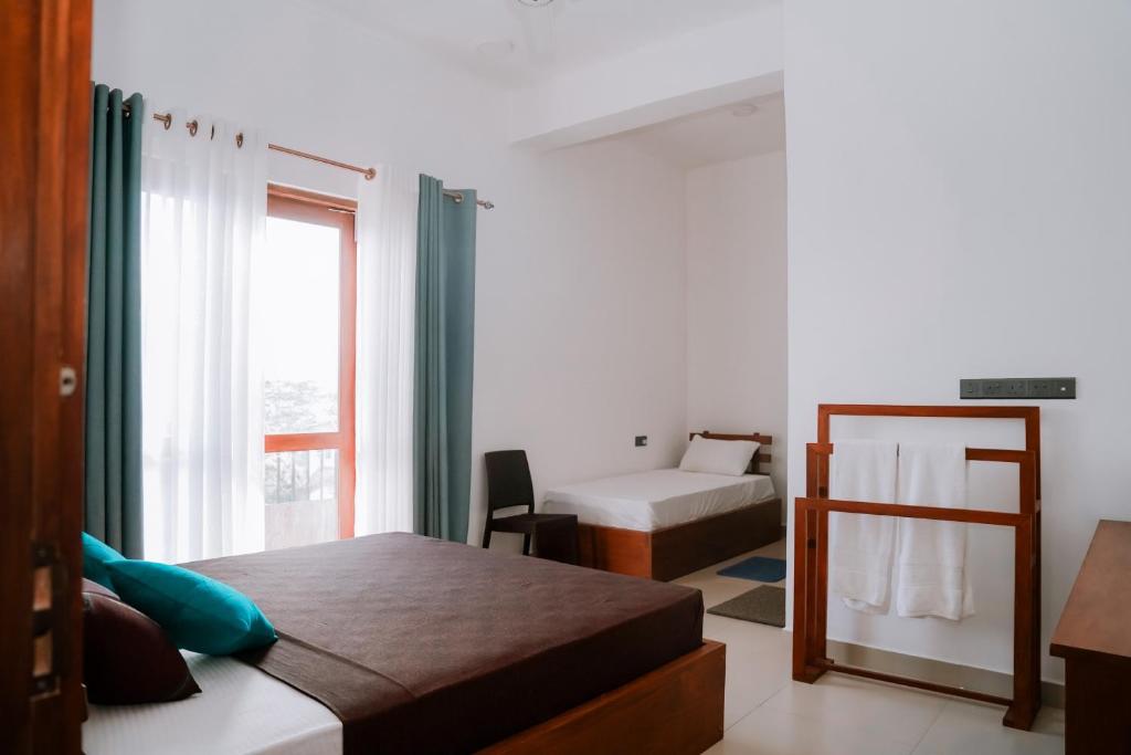 Postel nebo postele na pokoji v ubytování Golden sky Residence