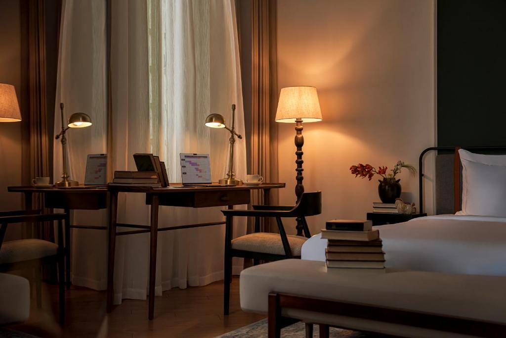 Giường trong phòng chung tại Signature by M Village Danang Heritage, A modern luxury stay
