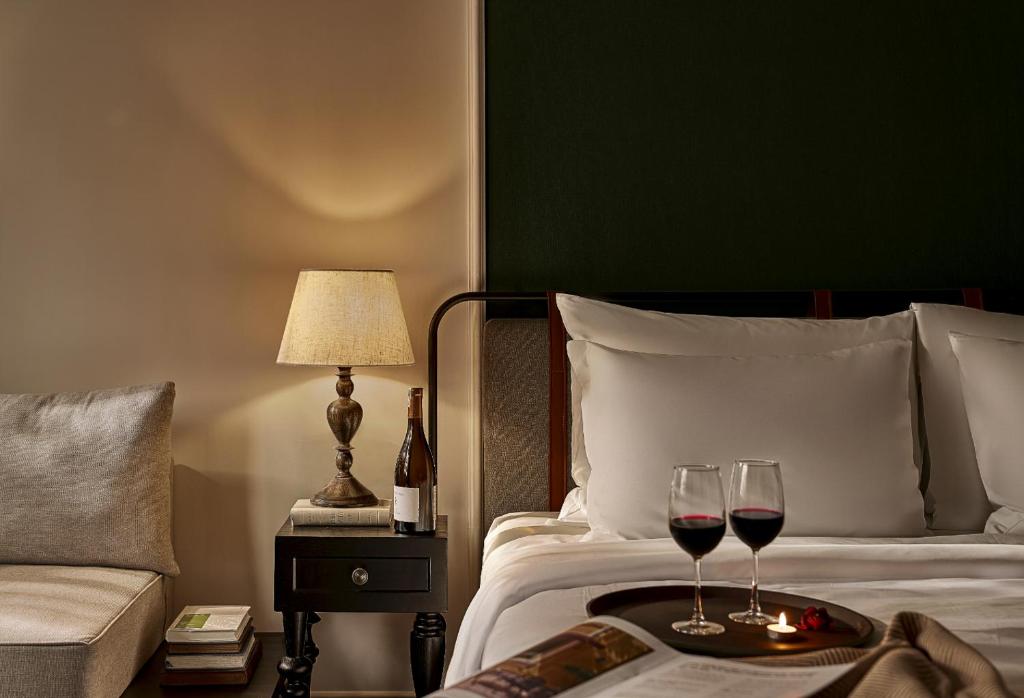 Giường trong phòng chung tại Signature by M Village Danang Heritage, A modern luxury stay