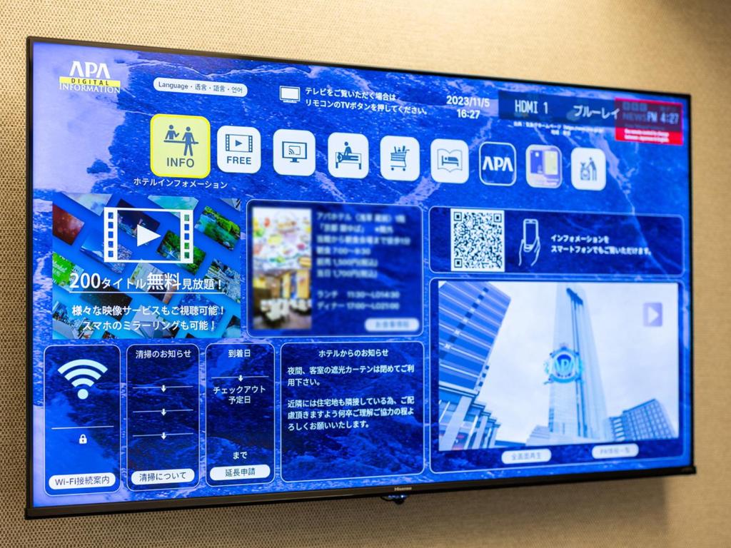 a blue board with many different stickers on it at APA Hotel Shibuya Dogenzakaue in Tokyo