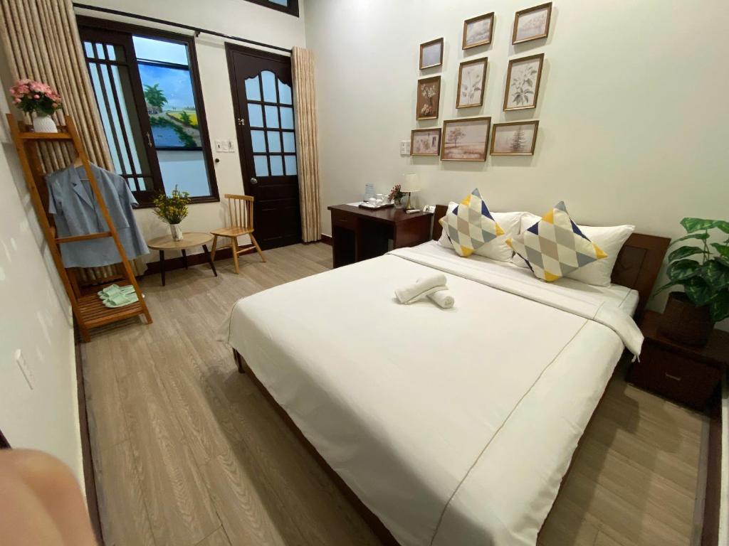 Giường trong phòng chung tại Lavande Hue Homestay