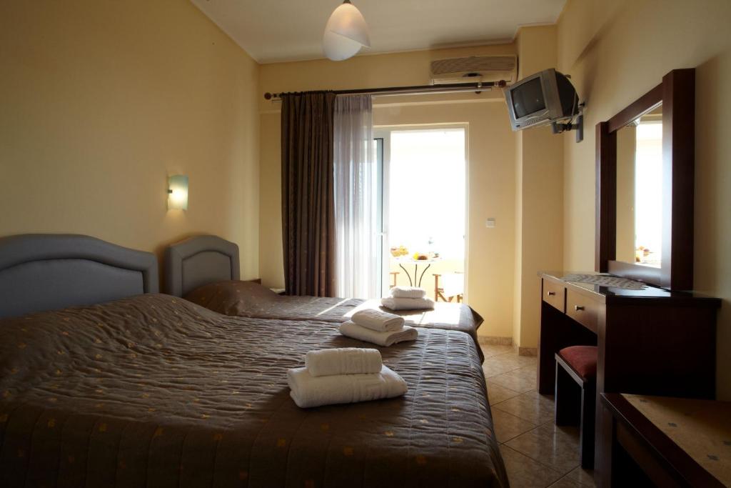 Postel nebo postele na pokoji v ubytování Evoikos beach & resort