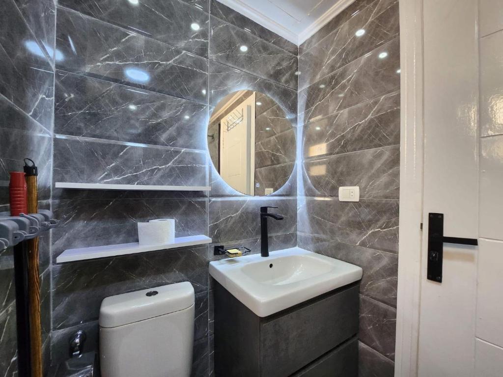 a bathroom with a sink and a mirror at Il rifugio di Daniela in Sharm El Sheikh
