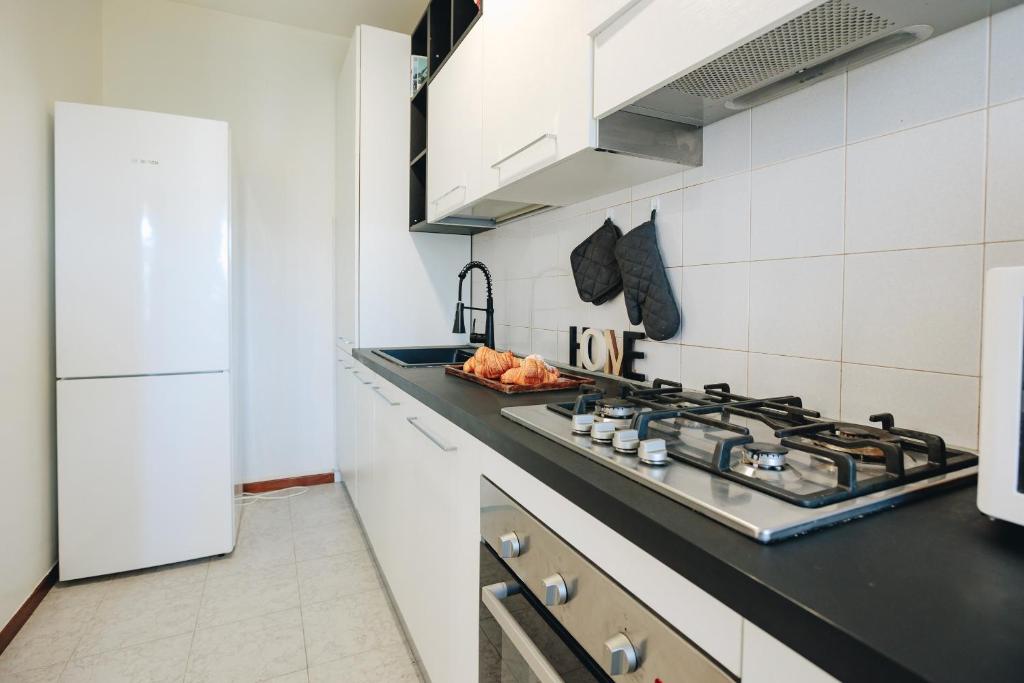 Kuchyňa alebo kuchynka v ubytovaní La Maison