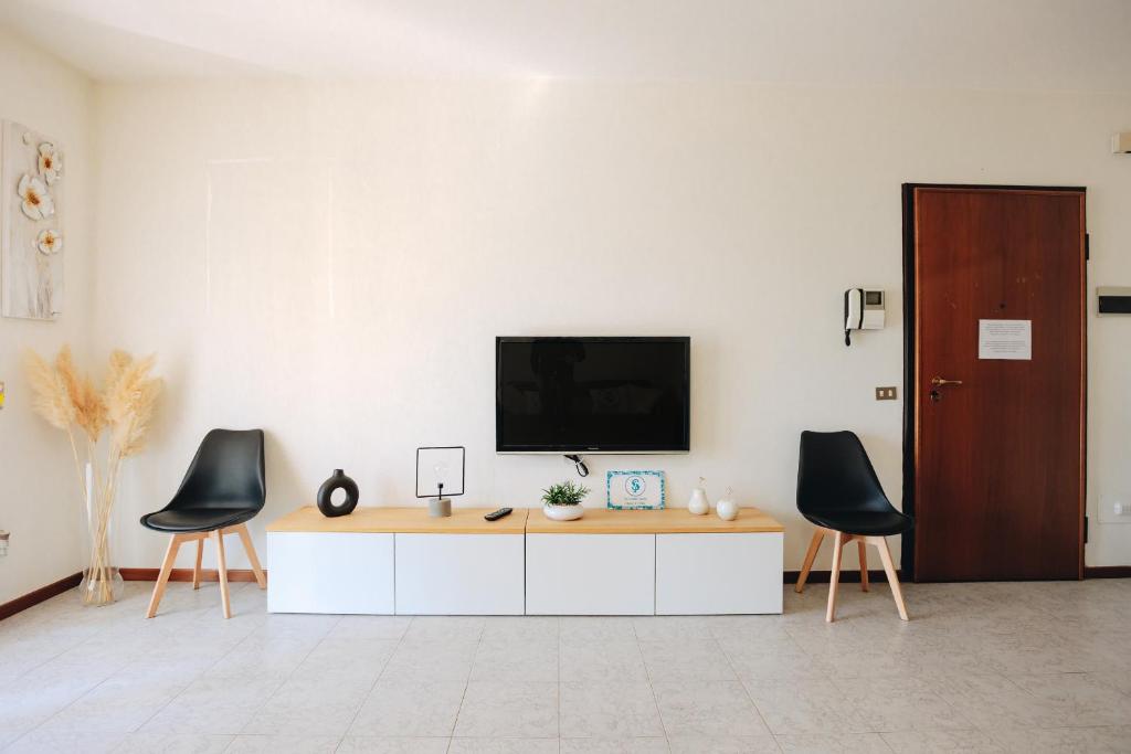 Televízia a/alebo spoločenská miestnosť v ubytovaní La Maison