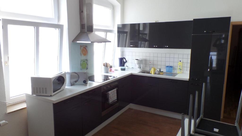 Kuchyň nebo kuchyňský kout v ubytování Hostel im Medizinerviertel