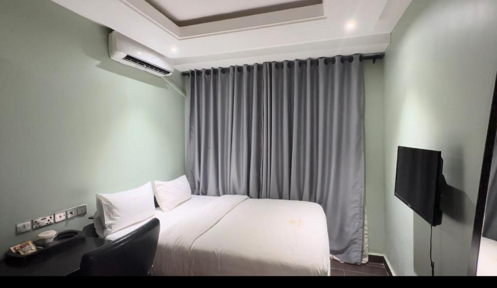 TV a/nebo společenská místnost v ubytování Rich-Bridge Hotel