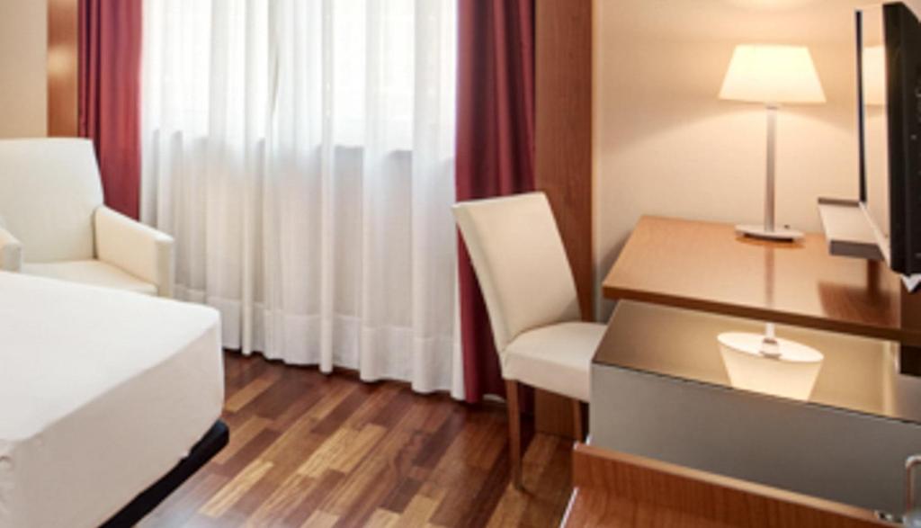 Postel nebo postele na pokoji v ubytování Sercotel AB Arganda