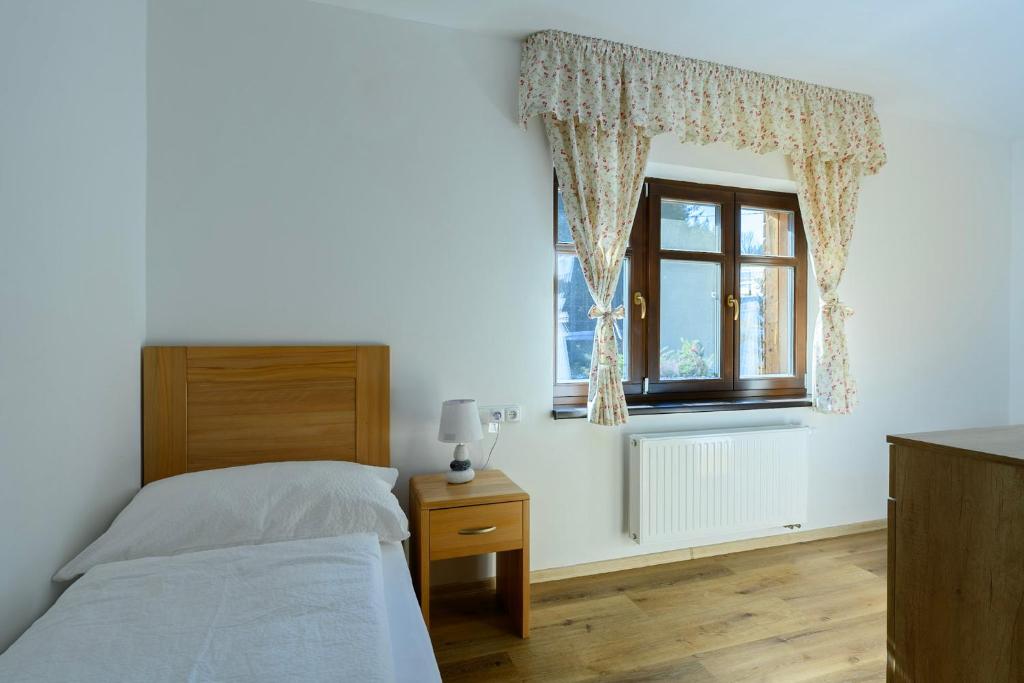 Postel nebo postele na pokoji v ubytování Apartmány Mezivodí