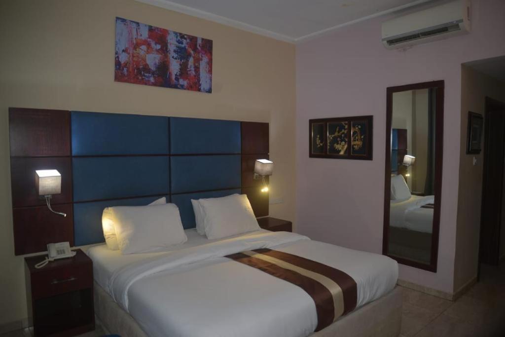 Postel nebo postele na pokoji v ubytování De Santos Hotel