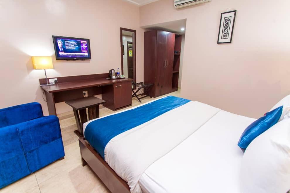Postel nebo postele na pokoji v ubytování De Santos Hotel