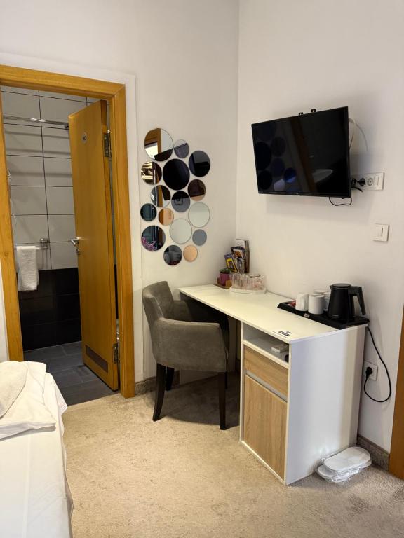 TV a/nebo společenská místnost v ubytování Deluxe Nortel Hotel