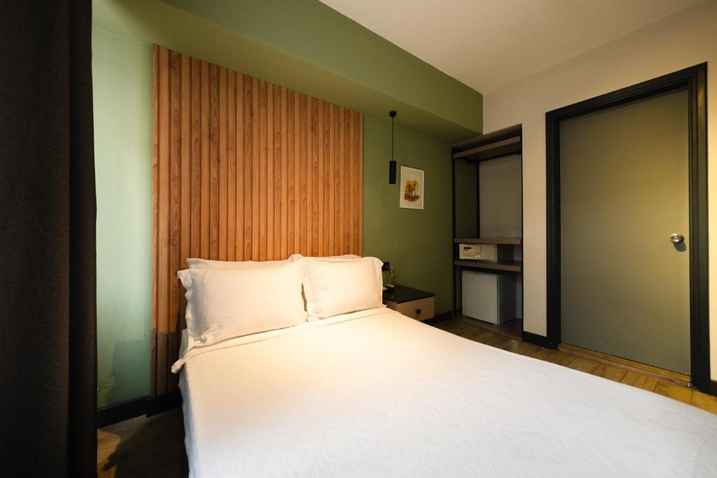 Postel nebo postele na pokoji v ubytování Polek Hotel