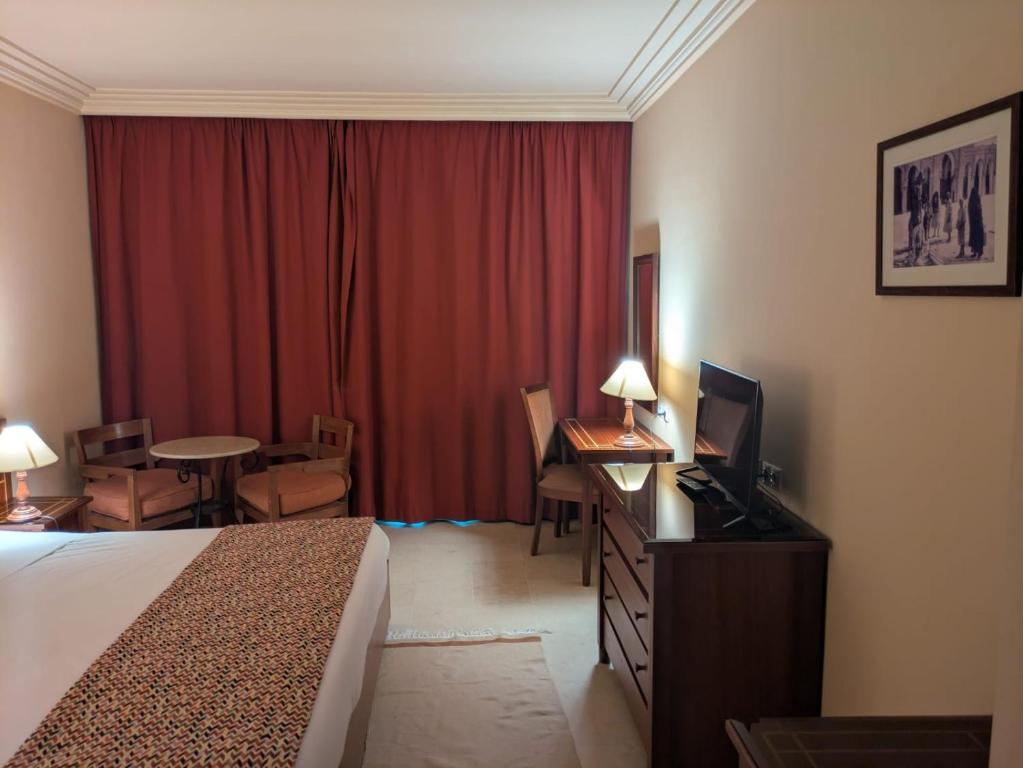 Postel nebo postele na pokoji v ubytování Hôtel LE CONSUL