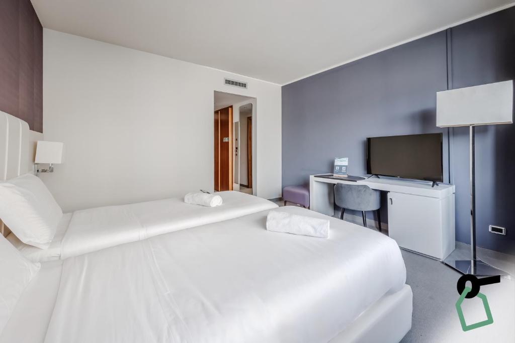 Postel nebo postele na pokoji v ubytování HOTIDAY Room Collection - Trapani