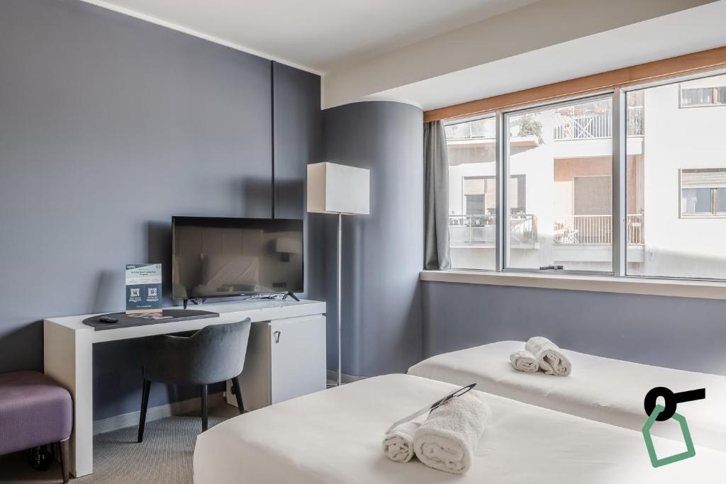 Postel nebo postele na pokoji v ubytování HOTIDAY Room Collection - Trapani
