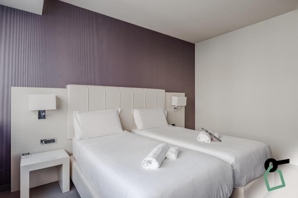 Postel nebo postele na pokoji v ubytování HOTIDAY Room Collection - Trapani