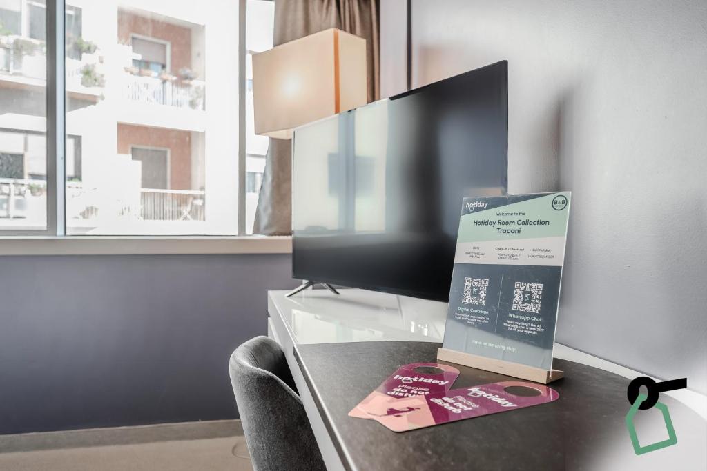 TV a/nebo společenská místnost v ubytování HOTIDAY Room Collection - Trapani