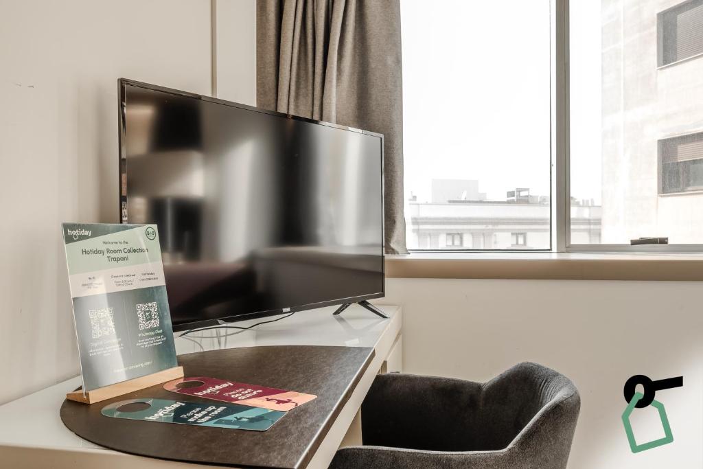 TV a/nebo společenská místnost v ubytování HOTIDAY Room Collection - Trapani